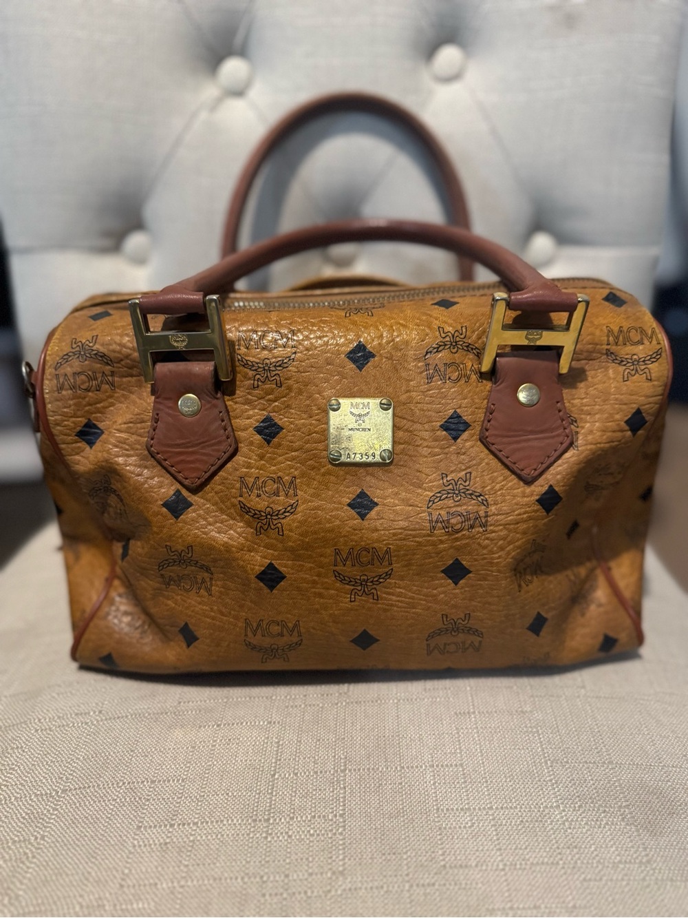 Vintage MCM Cognac Visetos Boston bag with a monogrammed coated canvas exterior.